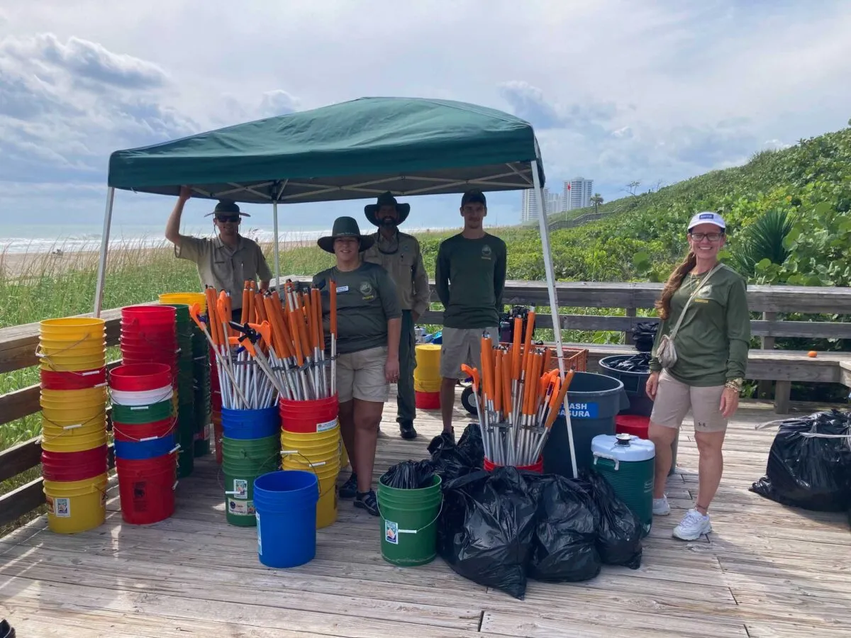 Volunteers cleaning up litter on the beach at MacArthur Beach State Park.