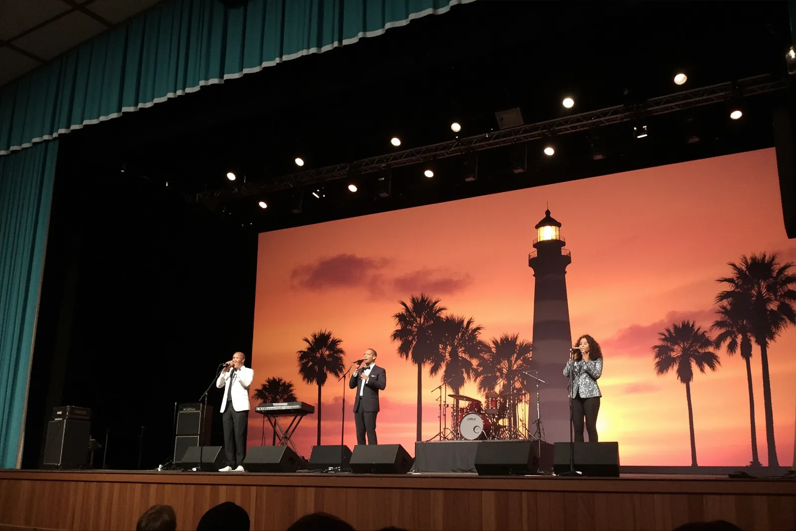 Performers on stage reenacting classic Motown groups like The Temptations and The Supremes.